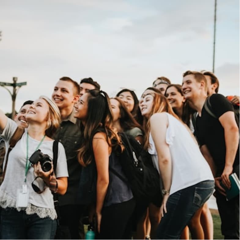 Group of people cheering at birthday photo