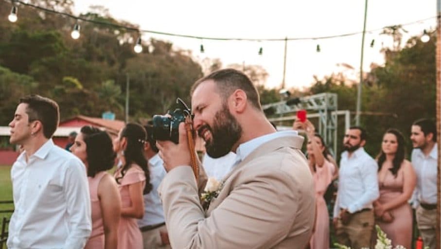 Wedding guests capturing candid moments at the ceremony