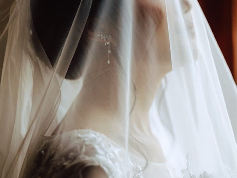 Bride in a beautiful wedding gown with floral details