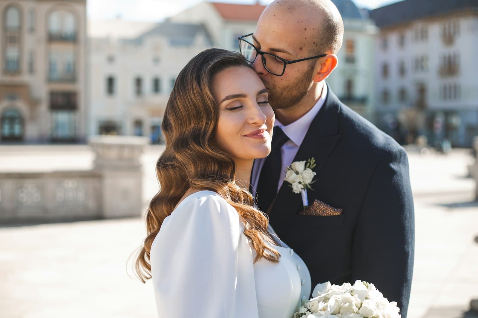 A couple embracing at their wedding